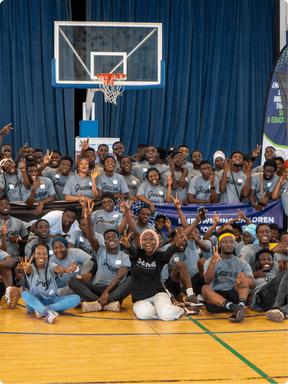 DUNK youth in matching shirts on a basketball court